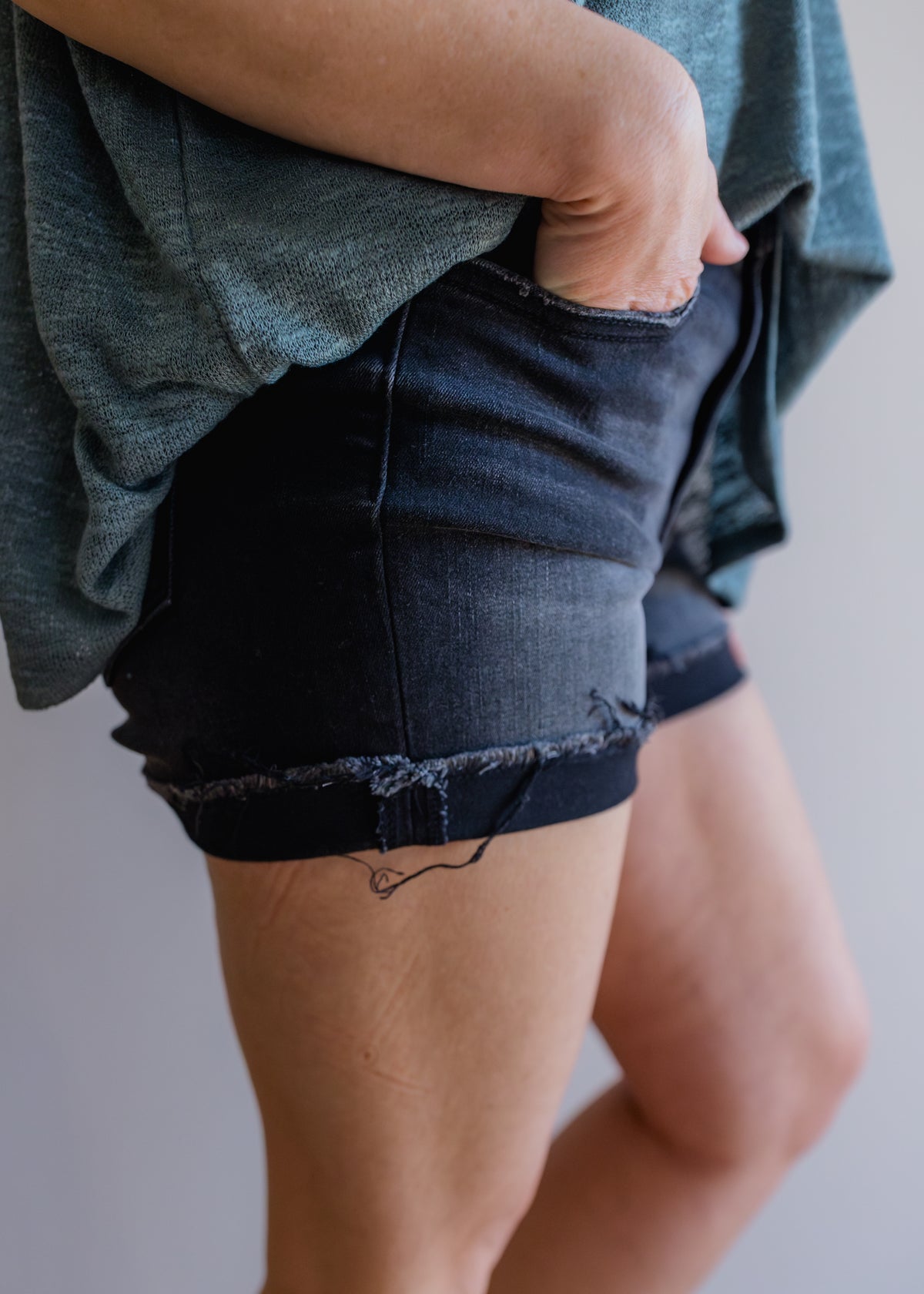 Washed Black Cuffed Raw Hem Denim Shorts